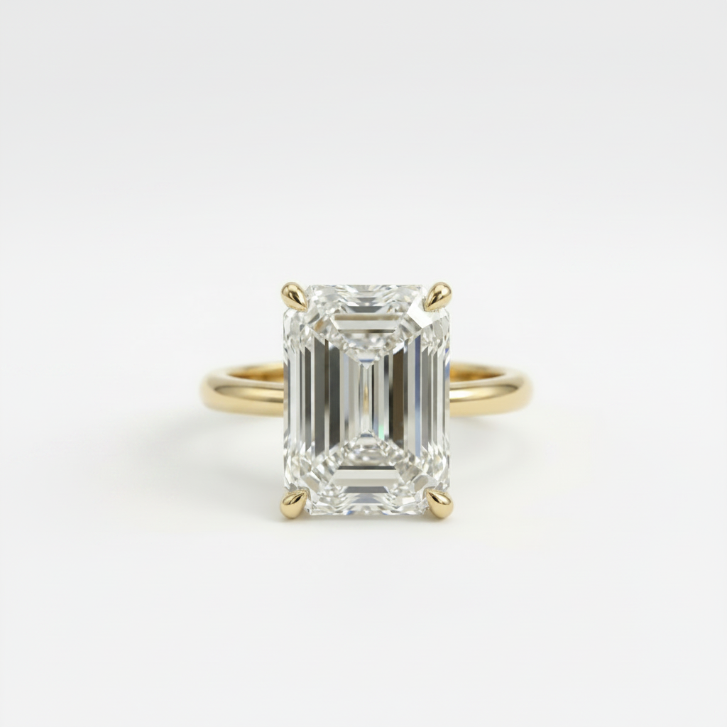 Gold ring with a large emerald-cut diamond on a white background