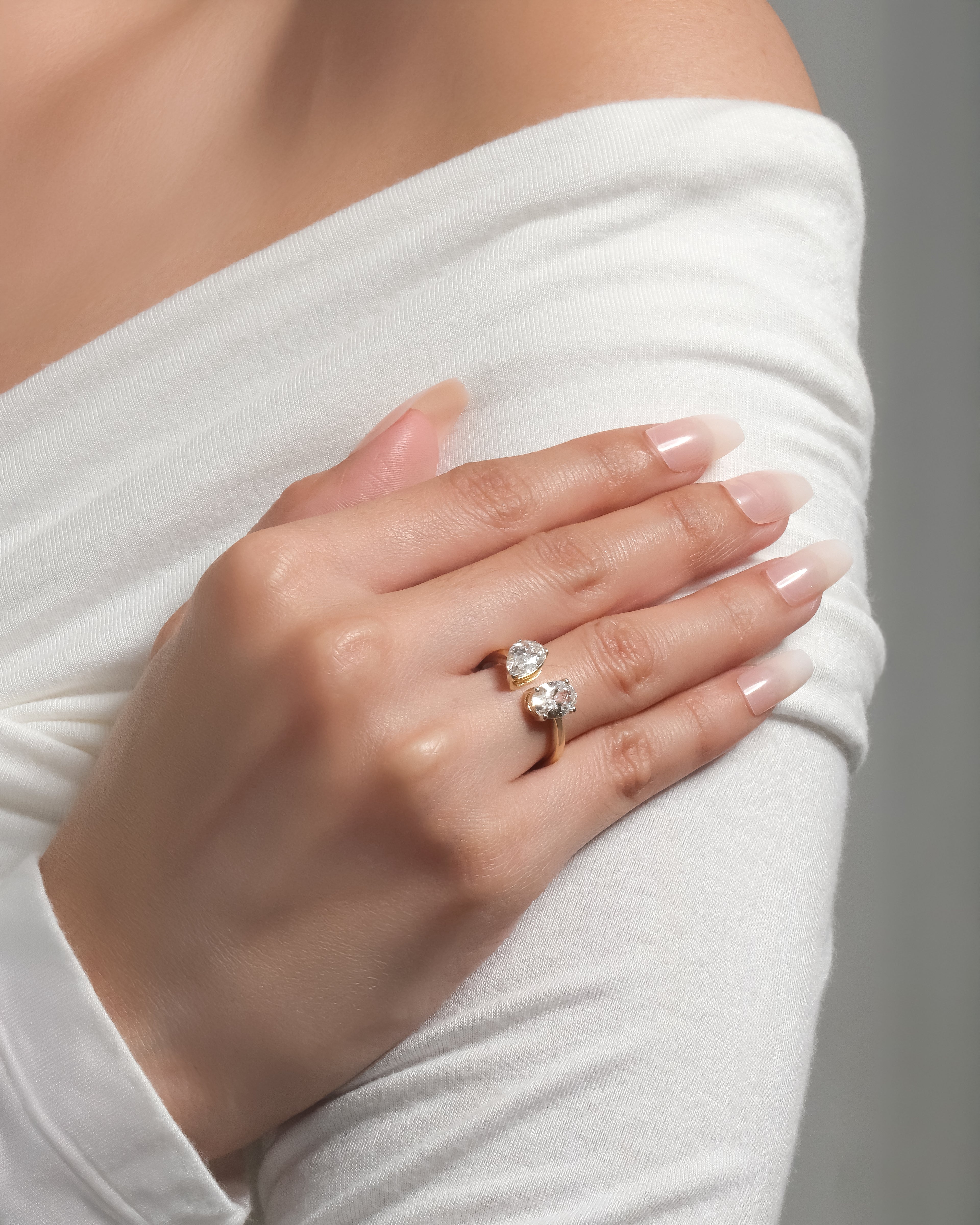 18K Toi et Moi lab-grown diamond engagement ring in gold with pear and oval  stones — Adira by Love & Diamonds, modern sustainable proposal ring Philippines.