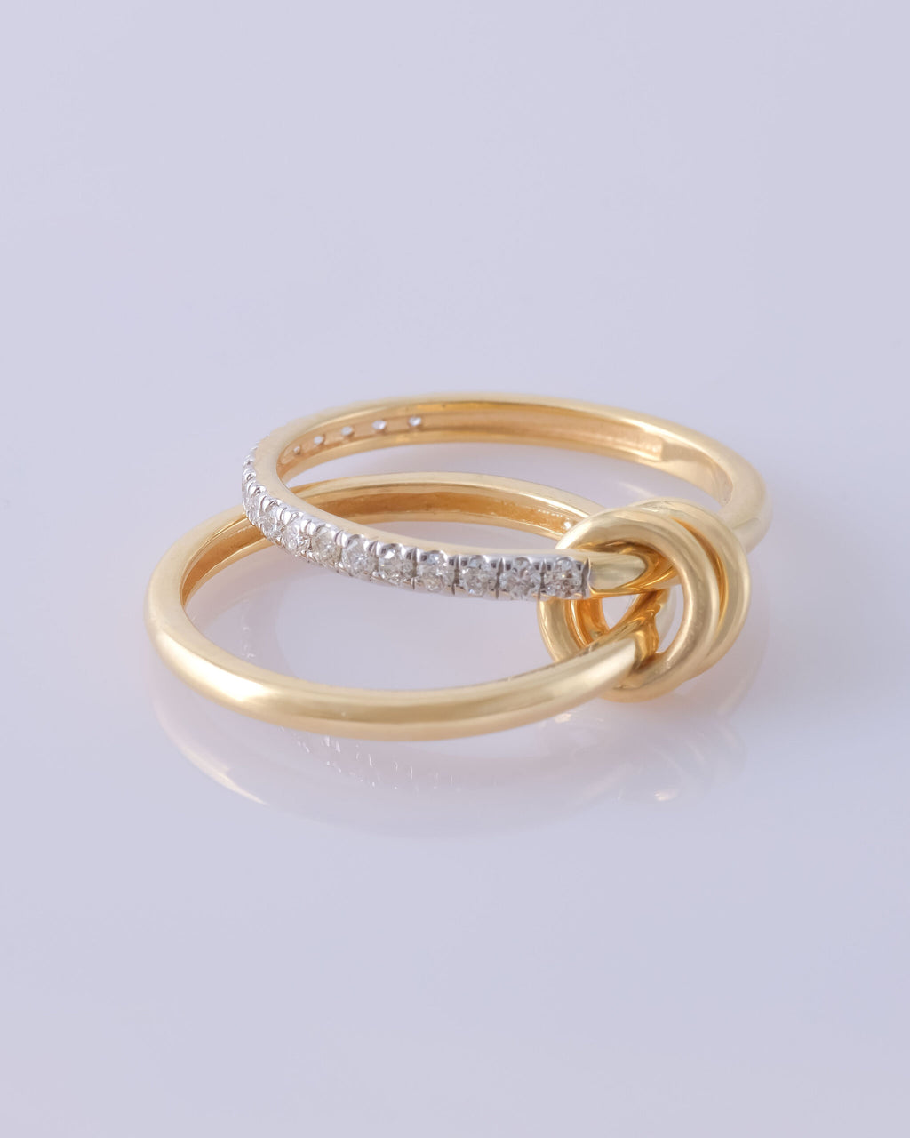 Avari 2-Band multi-wear gold ring featuring a pavé diamond band linked with smooth plain band, available in white and yellow gold.