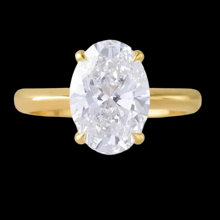 Gold ring with a large oval diamond on a black background