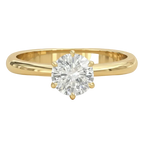 Gold ring with a diamond on a white background