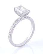 Diamond ring with a prominent gemstone on a white background