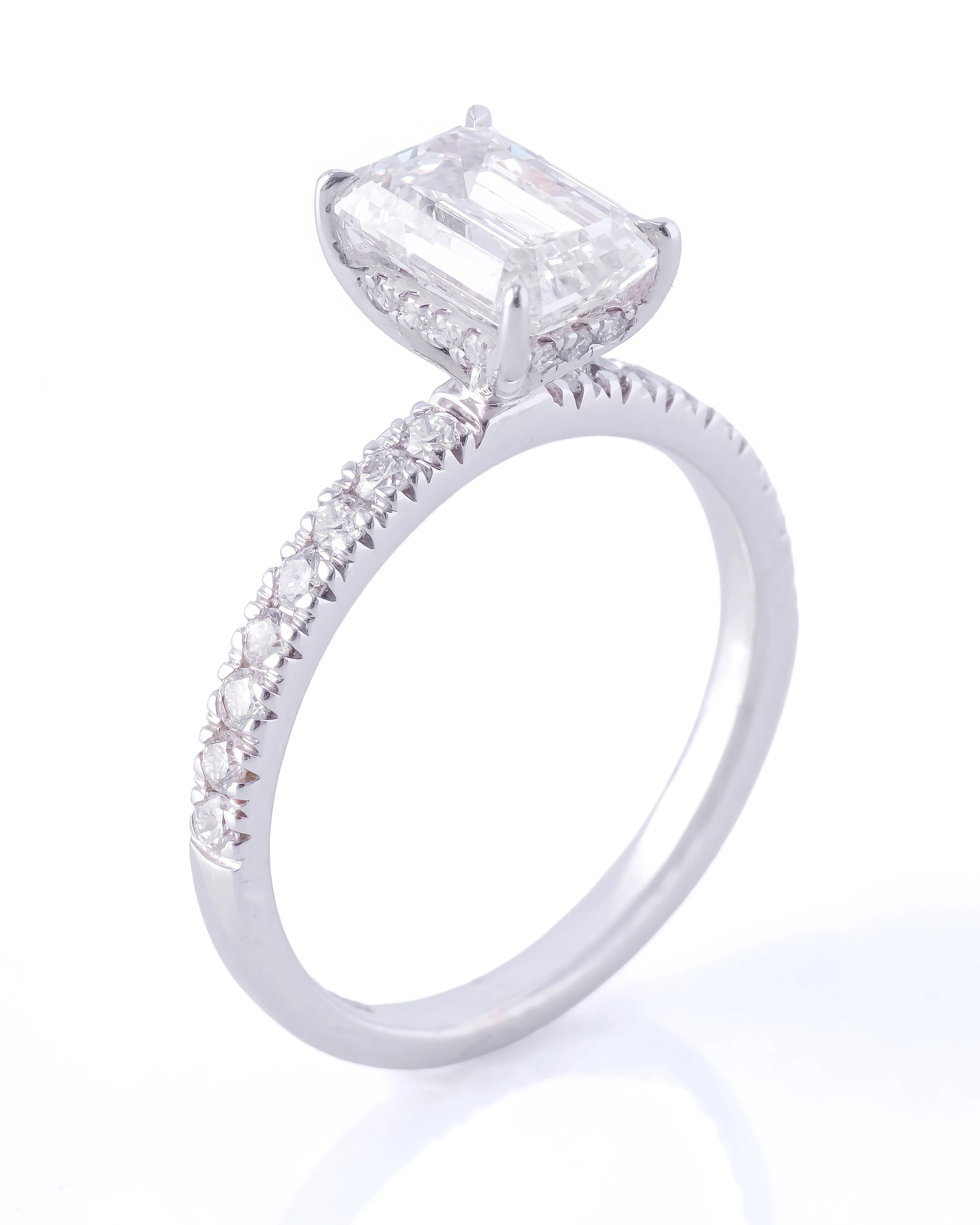 Diamond ring with a prominent gemstone on a white background